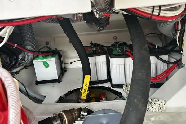 Slide: The Image of 2024 Jeanneau Leader 9.0 WA engine compartment with batteries and wiring. - 37