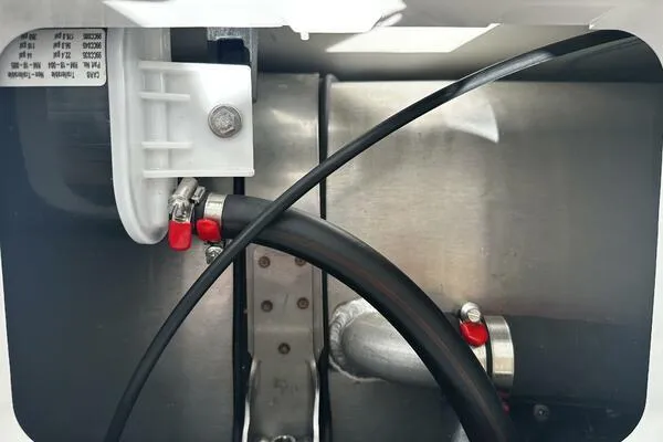 Slide: The Image of 2024 Jeanneau Leader 9.0 WA engine compartment with cables and connectors. - 38