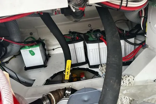 Slide: The Image of Battery compartment of 2024 Jeanneau Leader 9.0 WA boat, showing wiring and connections. - 39