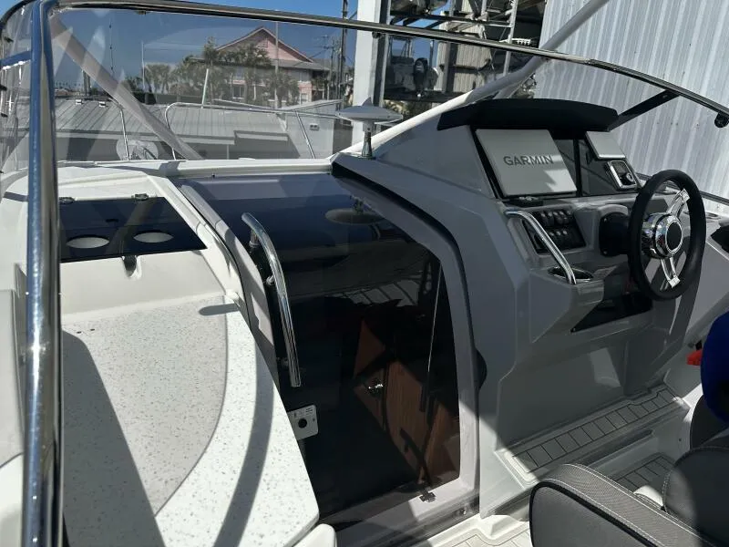 Slide: The Image of 2024 Jeanneau Leader 9.0 WA boat cockpit with Garmin navigation system. - 46
