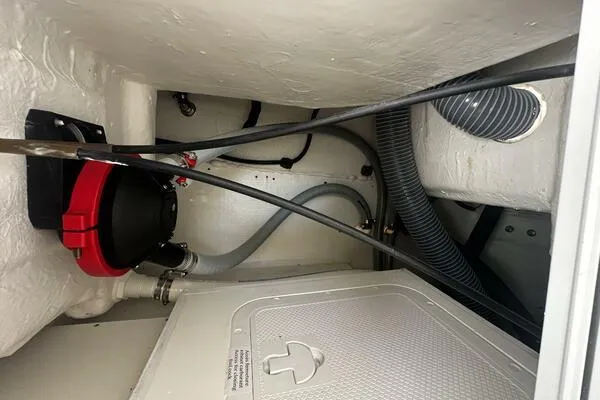 Slide: The Image of 2024 Jeanneau Leader 9.0 WA engine compartment with hoses and wiring. - 47