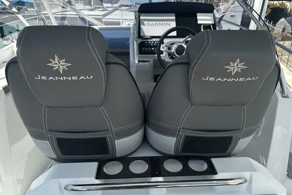 Slide: The Image of 2024 Jeanneau Leader 9.0 WA boat seats with Garmin navigation system in cockpit. - 8