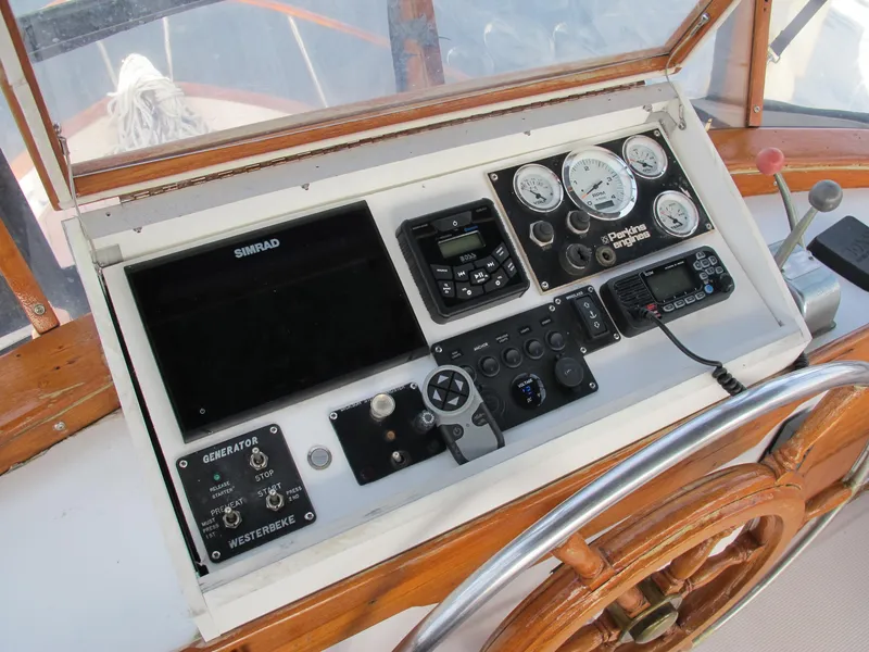 Slide: The Image of Control panel of a 1984 Monk 36 boat with navigation instruments and gauges. - 19