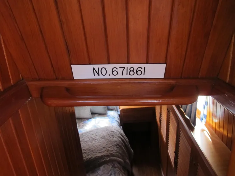 Slide: The Image of Wooden interior of 1984 Monk 36 boat with registration number 671861. - 48