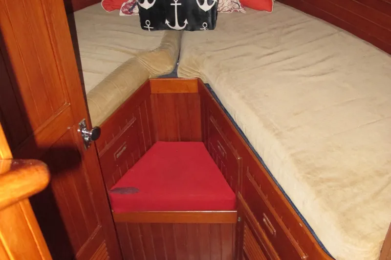Slide: The Image of 1984 Monk 36 boat cabin with wooden interior and twin beds. - 58