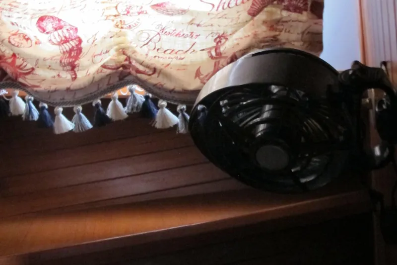 Slide: The Image of Wall-mounted fan under decorative curtain in a 1984 Monk 36 boat interior. - 59