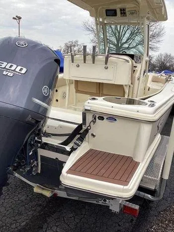 Slide: The Image of 2013 Scout 245 XFS boat with Yamaha 300 V6 engine, docked on a trailer. - 5