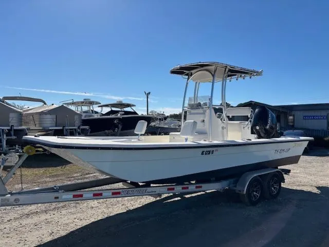 The Image of 2022 May-Craft 22 Hancock Skiff on trailer, parked outdoors under clear blue sky. - 1