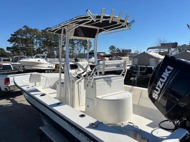 Slide: The Image of 2022 May-Craft 22 Hancock Skiff with Suzuki outboard motor, parked outdoors. - 10