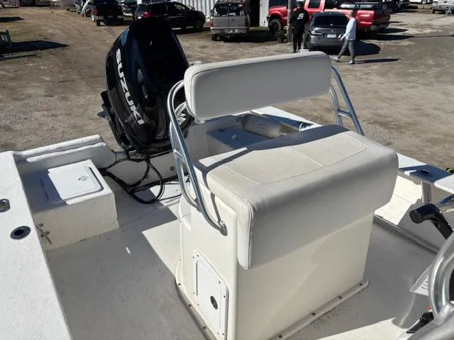 Slide: The Image of 2022 May-Craft 22 Hancock Skiff with Suzuki outboard motor, featuring a white cushioned seat. - 13