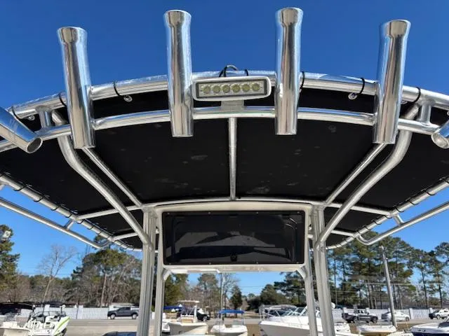 Slide: The Image of 2022 May-Craft 22 Hancock Skiff T-top with rod holders and LED light. - 15