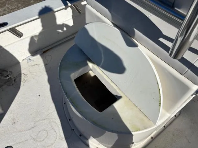 Slide: The Image of 2022 May-Craft 22 Hancock Skiff boat interior with open storage compartment. - 17