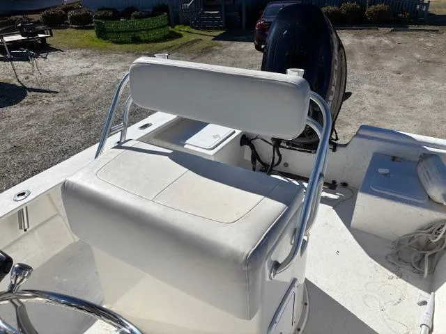 Slide: The Image of 2022 May-Craft 22 Hancock Skiff boat interior with white seating and steering console. - 20