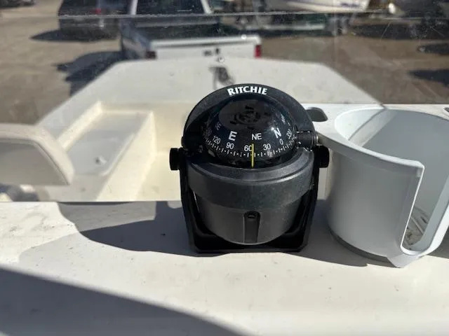 Slide: The Image of Compass on 2022 May-Craft 22 Hancock Skiff dashboard, sunny day. - 21