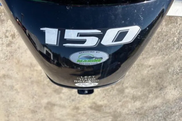 Slide: The Image of Outboard motor with "150" label on a 2022 May-Craft 22 Hancock Skiff. - 22
