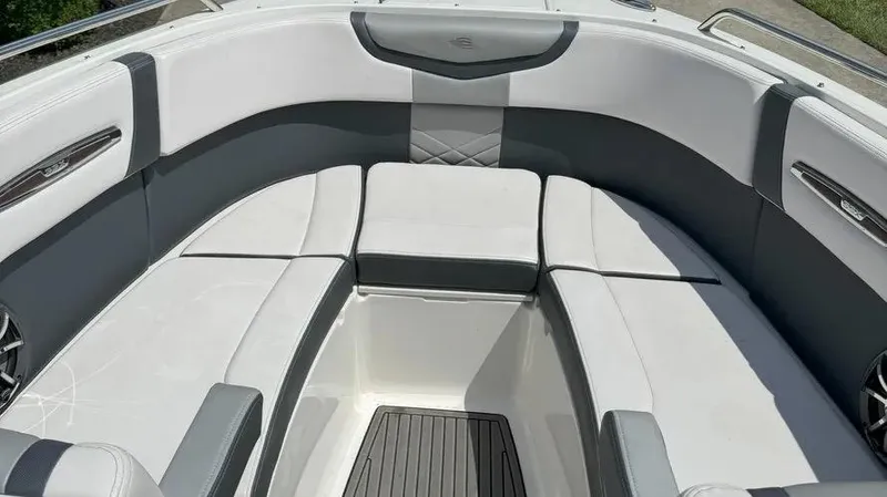 Slide: The Image of 2019 Chaparral 257 SSX boat interior with white and gray seating. - 14