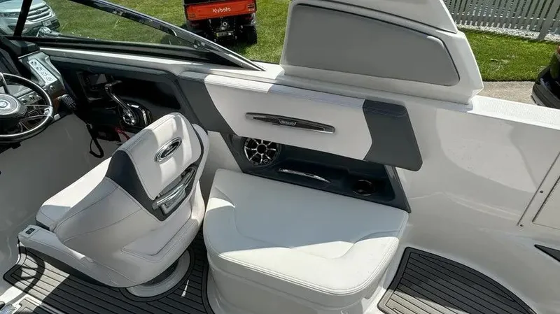 Slide: The Image of 2019 Chaparral 257 SSX boat interior with steering wheel and seating area. - 17