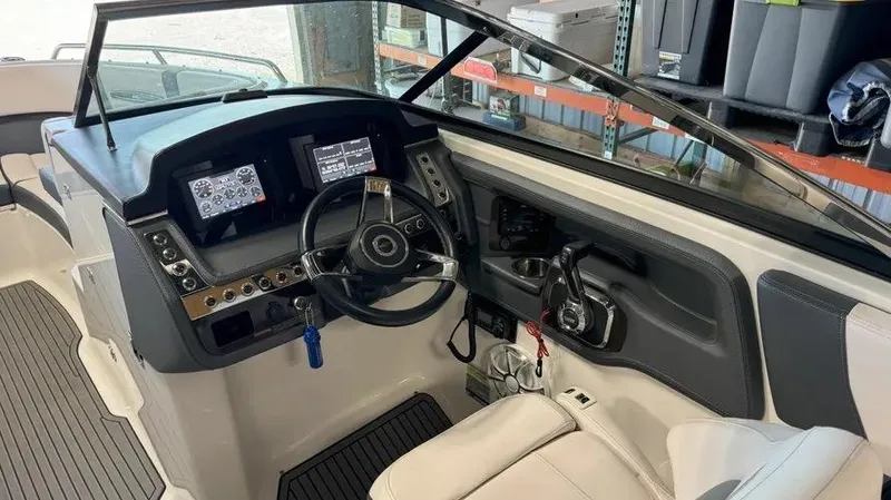 Slide: The Image of 2019 Chaparral 257 SSX boat interior with modern dashboard and steering wheel. - 19