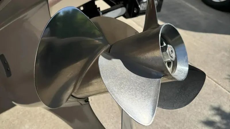 Slide: The Image of Close-up of a 2019 Chaparral 257 SSX boat propeller, showcasing its sleek metal blades. - 24