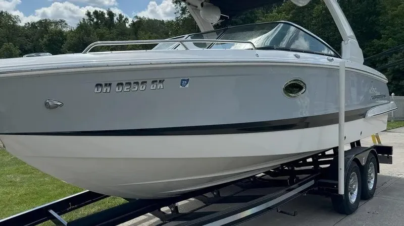 Slide: The Image of 2019 Chaparral 257 SSX boat on trailer, side view, outdoors. - 3