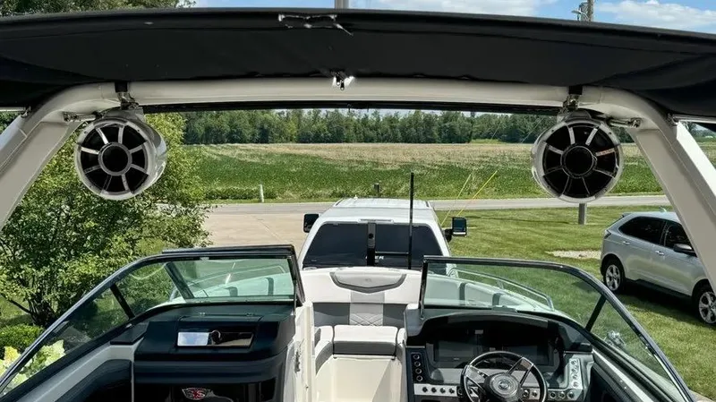 Slide: The Image of Interior view of 2019 Chaparral 257 SSX boat with speakers and dashboard. - 30