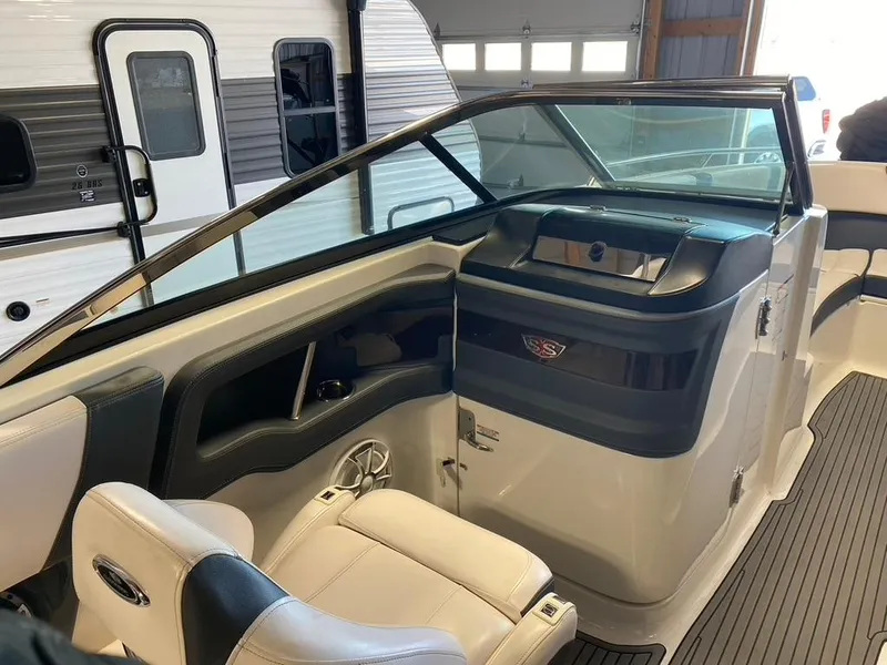 Slide: The Image of 2019 Chaparral 257 SSX boat interior with sleek seating and modern dashboard design. - 5