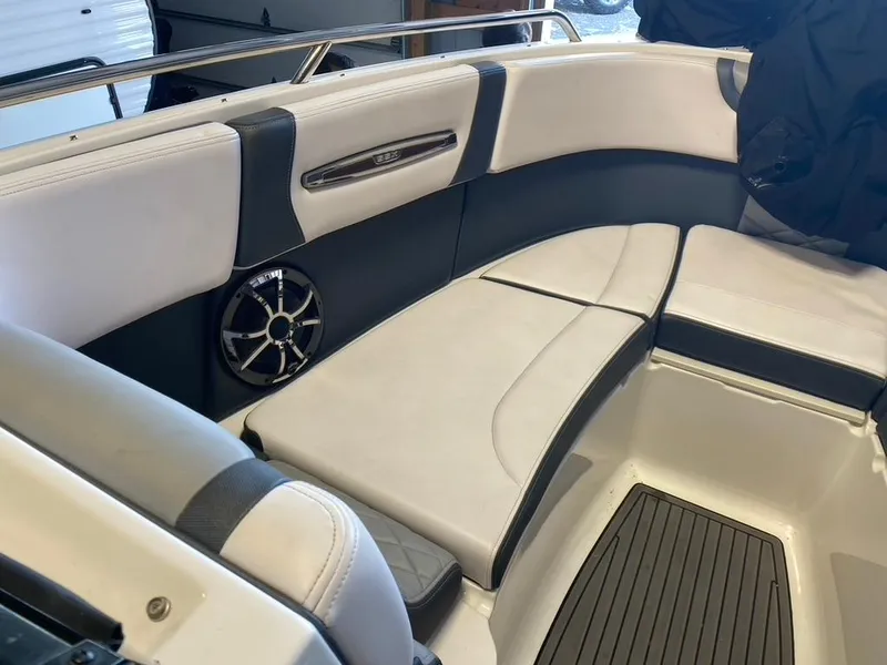 Slide: The Image of Interior seating of a 2019 Chaparral 257 SSX boat, featuring sleek design and speaker system. - 7