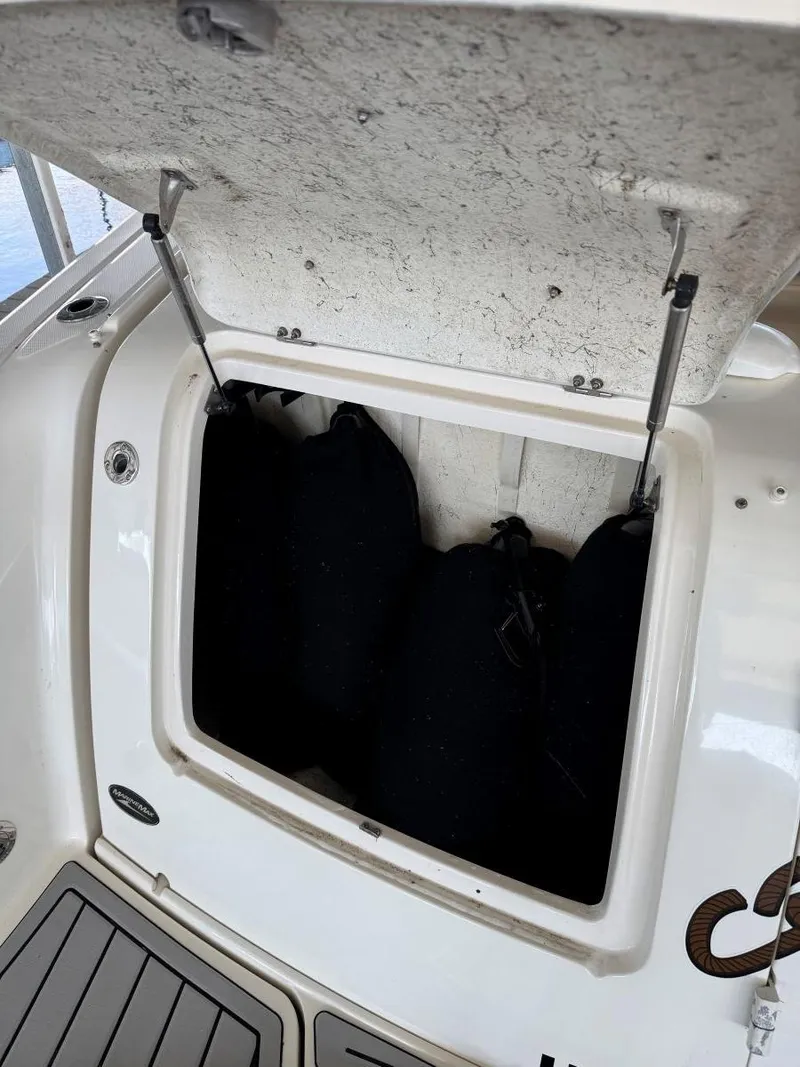 Slide: The Image of Storage compartment on a 2007 Sea Ray 38 Sundancer boat with fenders inside. - 15