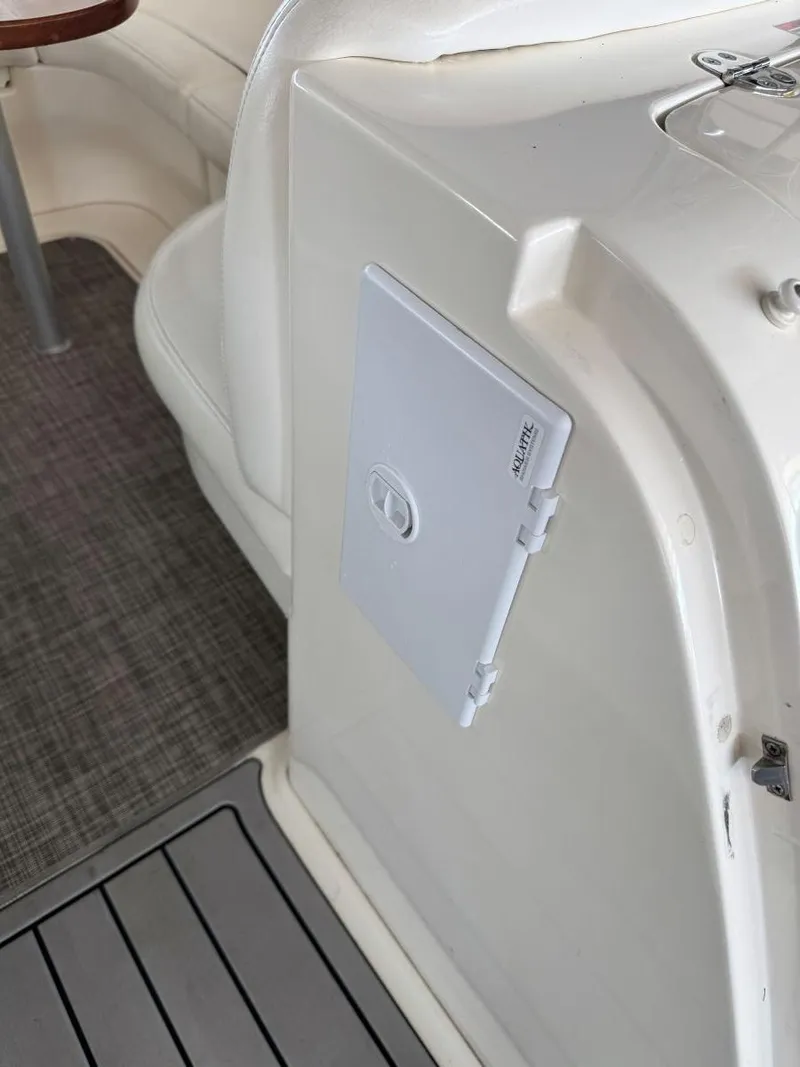 Slide: The Image of 2007 Sea Ray 38 Sundancer interior with white panel and gray flooring. - 17