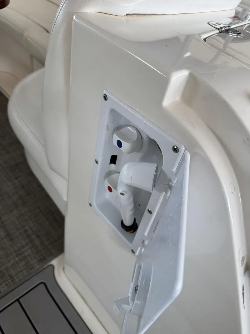 Slide: The Image of 2007 Sea Ray 38 Sundancer boat water hookup panel with open cover. - 18