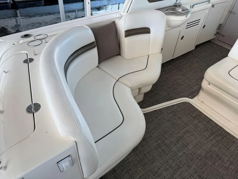 Slide: The Image of 2007 Sea Ray 38 Sundancer interior with white leather seating and modern design. - 21