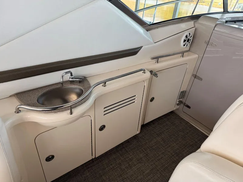 Slide: The Image of 2007 Sea Ray 38 Sundancer yacht interior with sink and storage cabinets. - 22