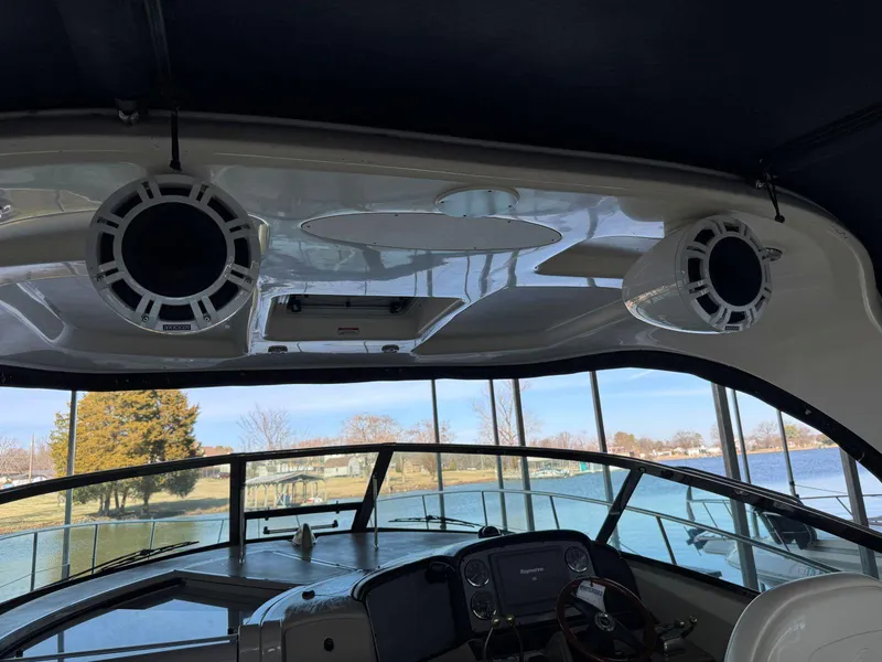 Slide: The Image of Interior view of 2007 Sea Ray 38 Sundancer boat with speakers and helm. - 26
