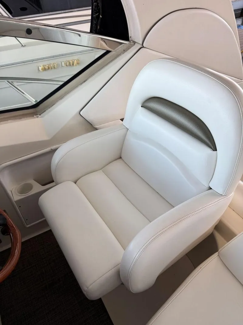 Slide: The Image of Luxury white leather seat in 2007 Sea Ray 38 Sundancer yacht cockpit. - 27