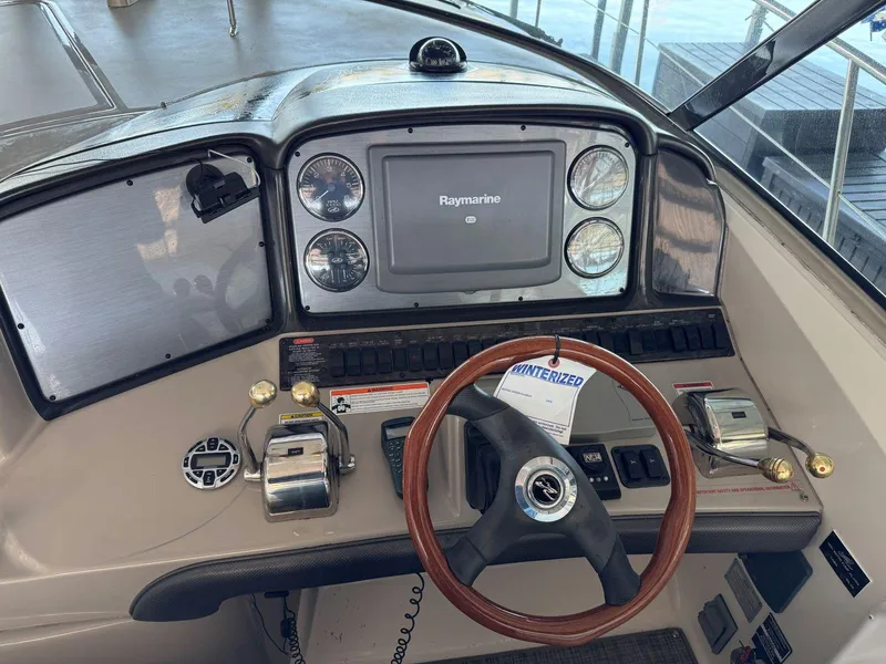 Slide: The Image of Helm of 2007 Sea Ray 38 Sundancer with Raymarine navigation system and wooden steering wheel. - 30