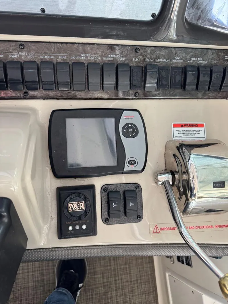 Slide: The Image of Control panel of a 2007 Sea Ray 38 Sundancer boat with navigation equipment. - 31