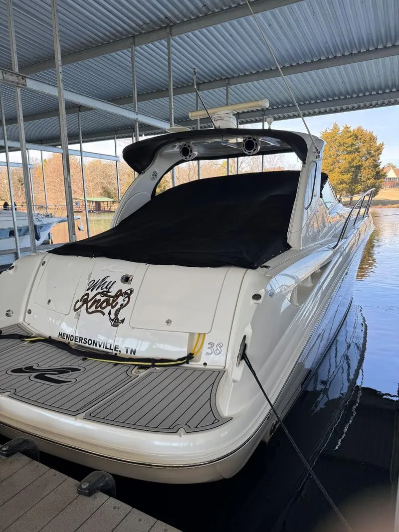 Slide: The Image of 2007 Sea Ray 38 Sundancer docked under a covered marina. - 37
