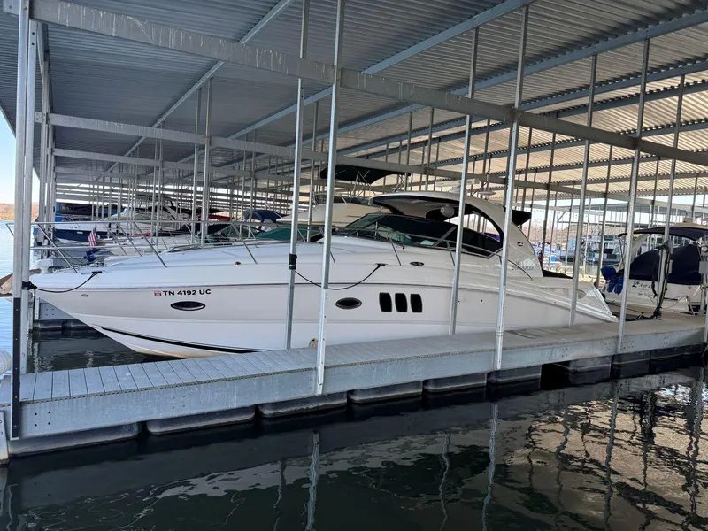 Slide: The Image of 2007 Sea Ray 38 Sundancer docked in a covered marina. - 40