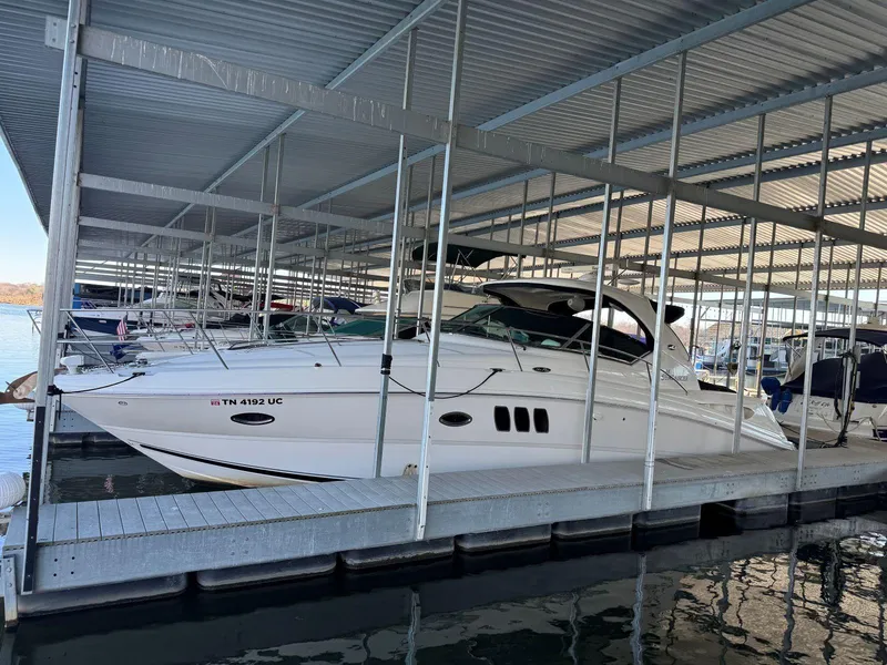 Slide: The Image of 2007 Sea Ray 38 Sundancer docked in a covered marina. - 41