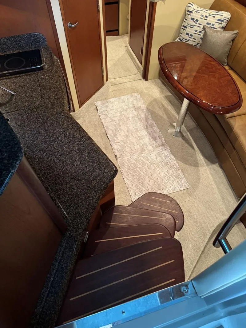 Slide: The Image of Interior of 2007 Sea Ray 38 Sundancer with cozy seating and elegant wood finishes. - 47