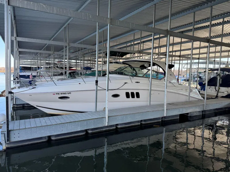 Slide: The Image of 2007 Sea Ray 38 Sundancer docked in a covered marina. - 5