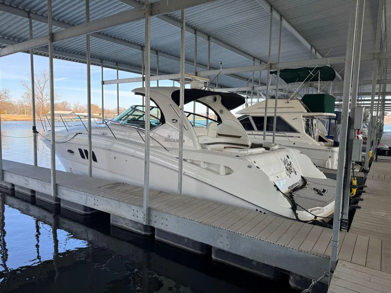 Slide: The Image of 2007 Sea Ray 38 Sundancer docked in a covered marina slip. - 8