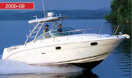 Slide: The Image of 2000 Sea Ray 290 Amberjack cruising on a calm lake. - 0
