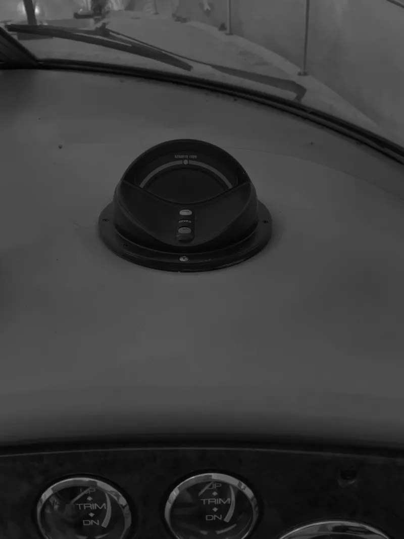 Slide: The Image of Dashboard of a 2000 Sea Ray 290 Amberjack boat with gauges and compass. - 12