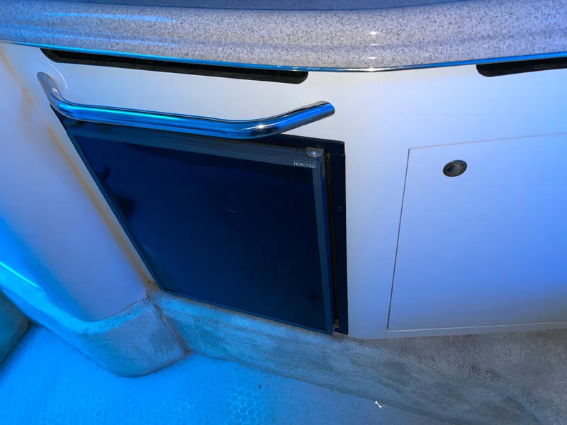 Slide: The Image of Interior of 2000 Sea Ray 290 Amberjack with built-in mini fridge. - 27