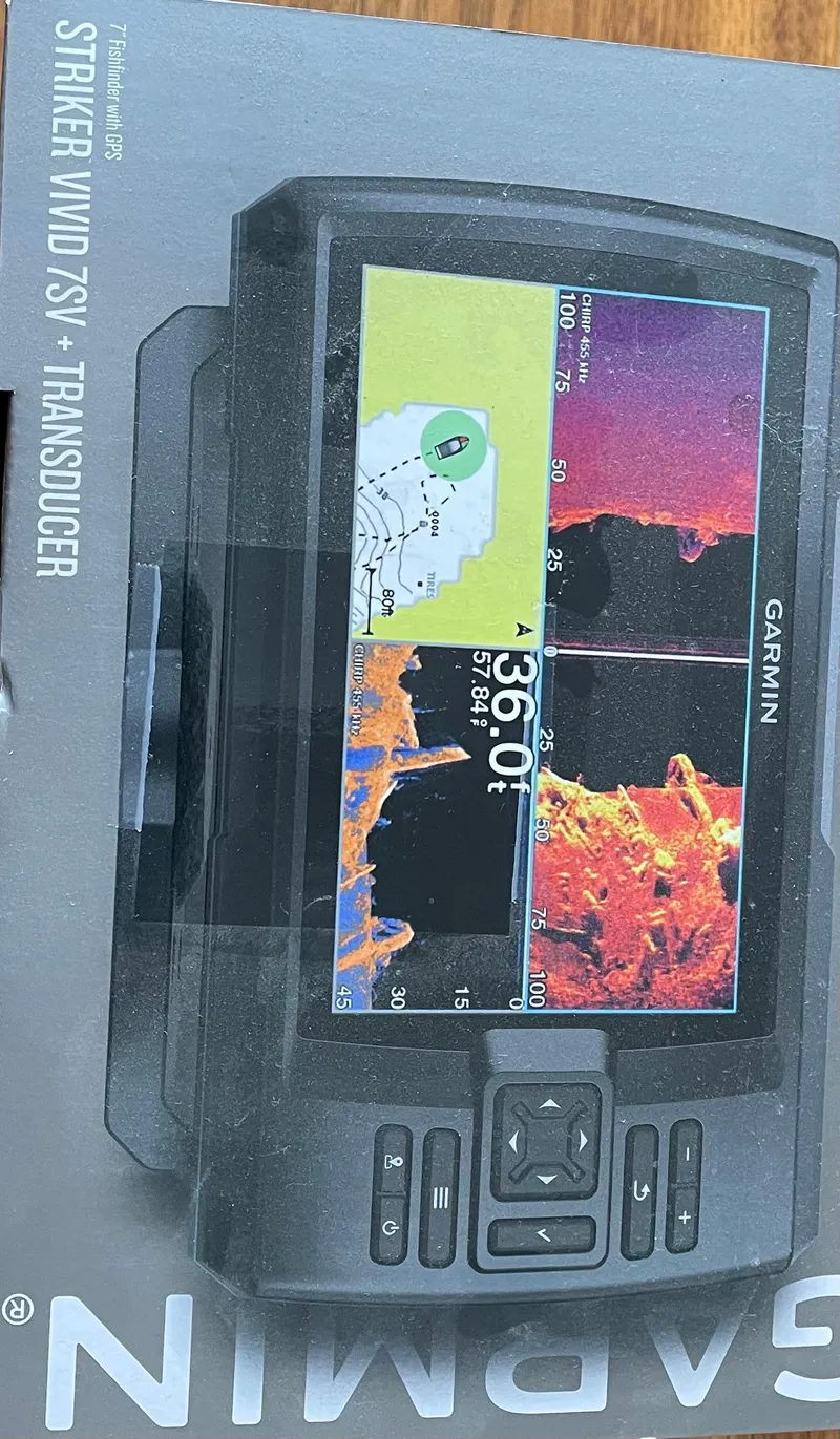 Slide: The Image of Garmin Striker Vivid 7SV fishfinder with transducer, displayed on packaging. - 28