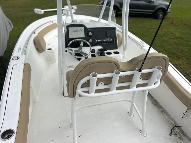 Slide: The Image of 2016 Tidewater 210 LXF boat interior with steering console and seating. - 12