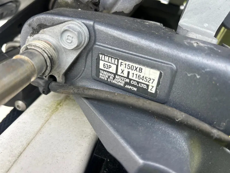 Slide: The Image of Close-up of Yamaha F150X8 engine part on 2016 Tidewater 210 LXF boat. - 17