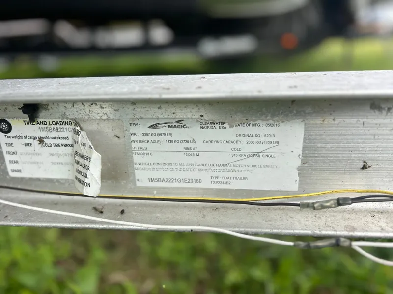 Slide: The Image of Close-up of a 2016 Tidewater 210 LXF boat trailer label with specifications. - 18