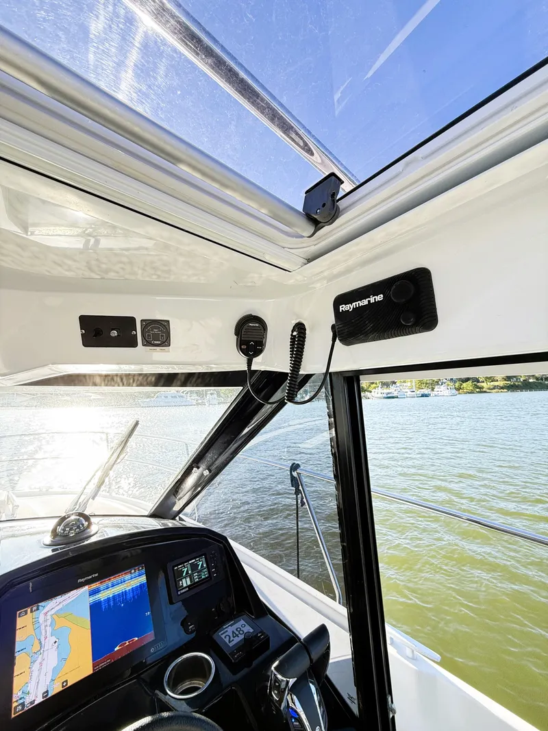 Slide: The Image of Interior view of 2021 Jeanneau NC 895 boat cockpit with navigation equipment. - 21